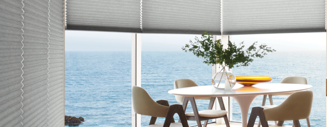 Custom window shades in a bright coastal-style living room