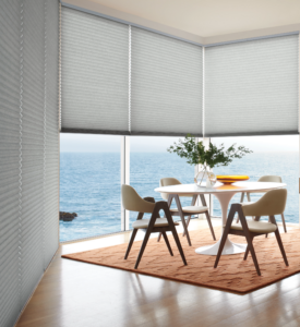 Custom window shades in a bright coastal-style living room
